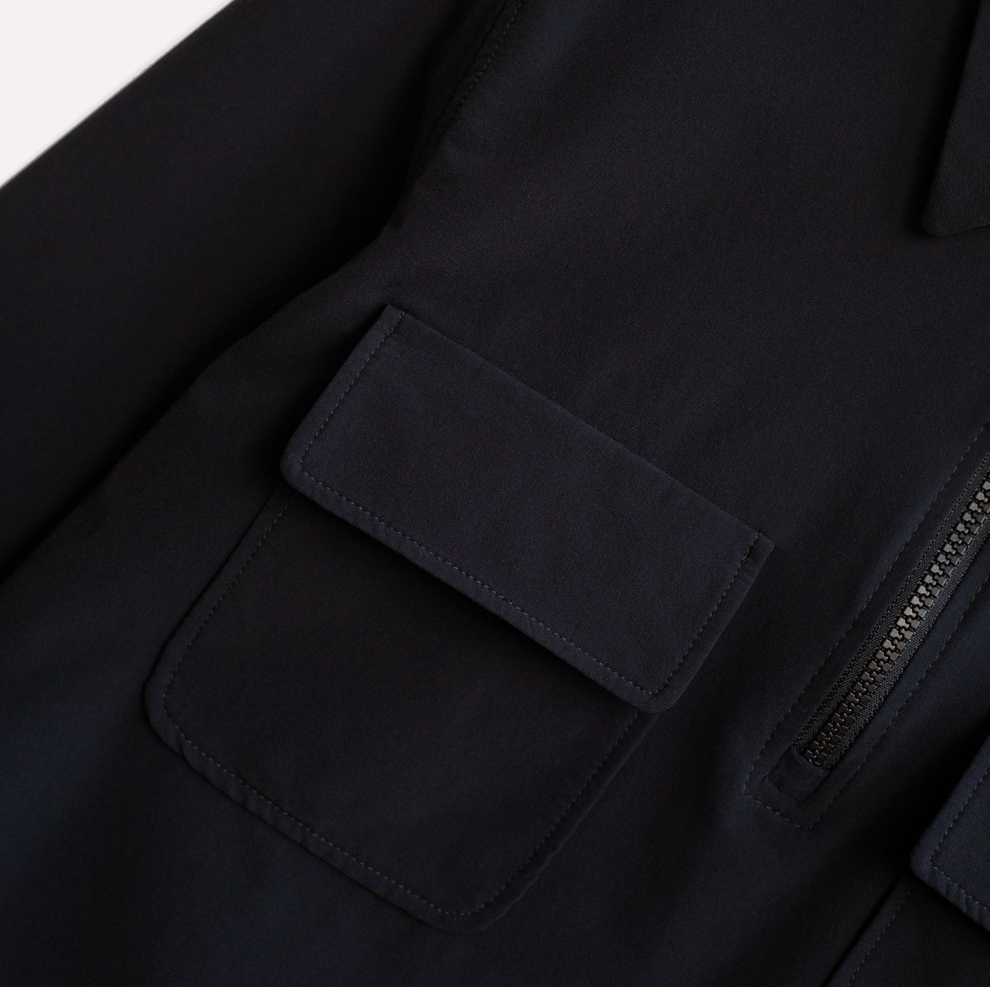 Shirt pockets on lightweight climbing half-zip shirt.