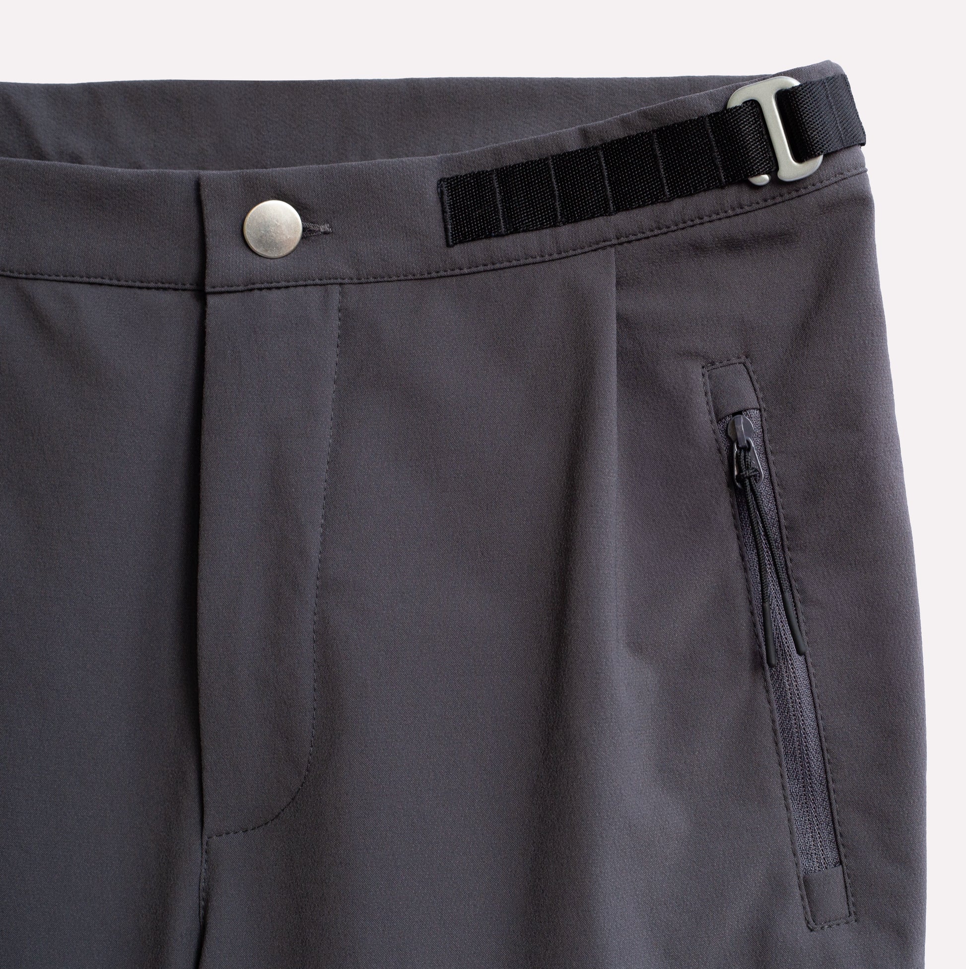 Adjustable climbing pant with zip pockets detail.