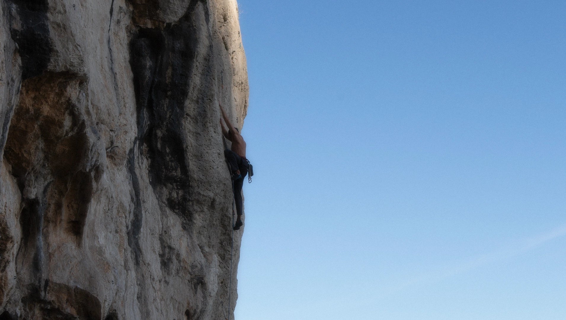 Sport climber on a climbing route above Monaco France.