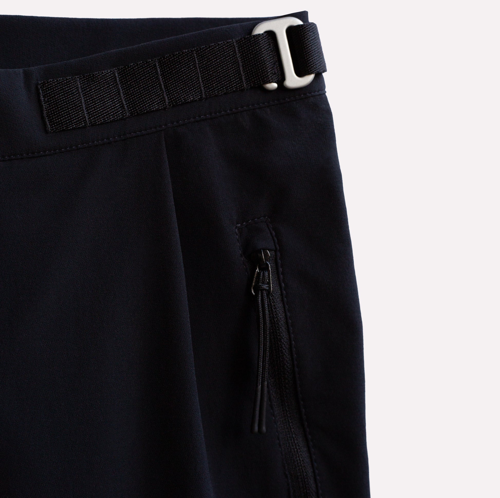 Technical pants for climbing in black lightweight fabric.