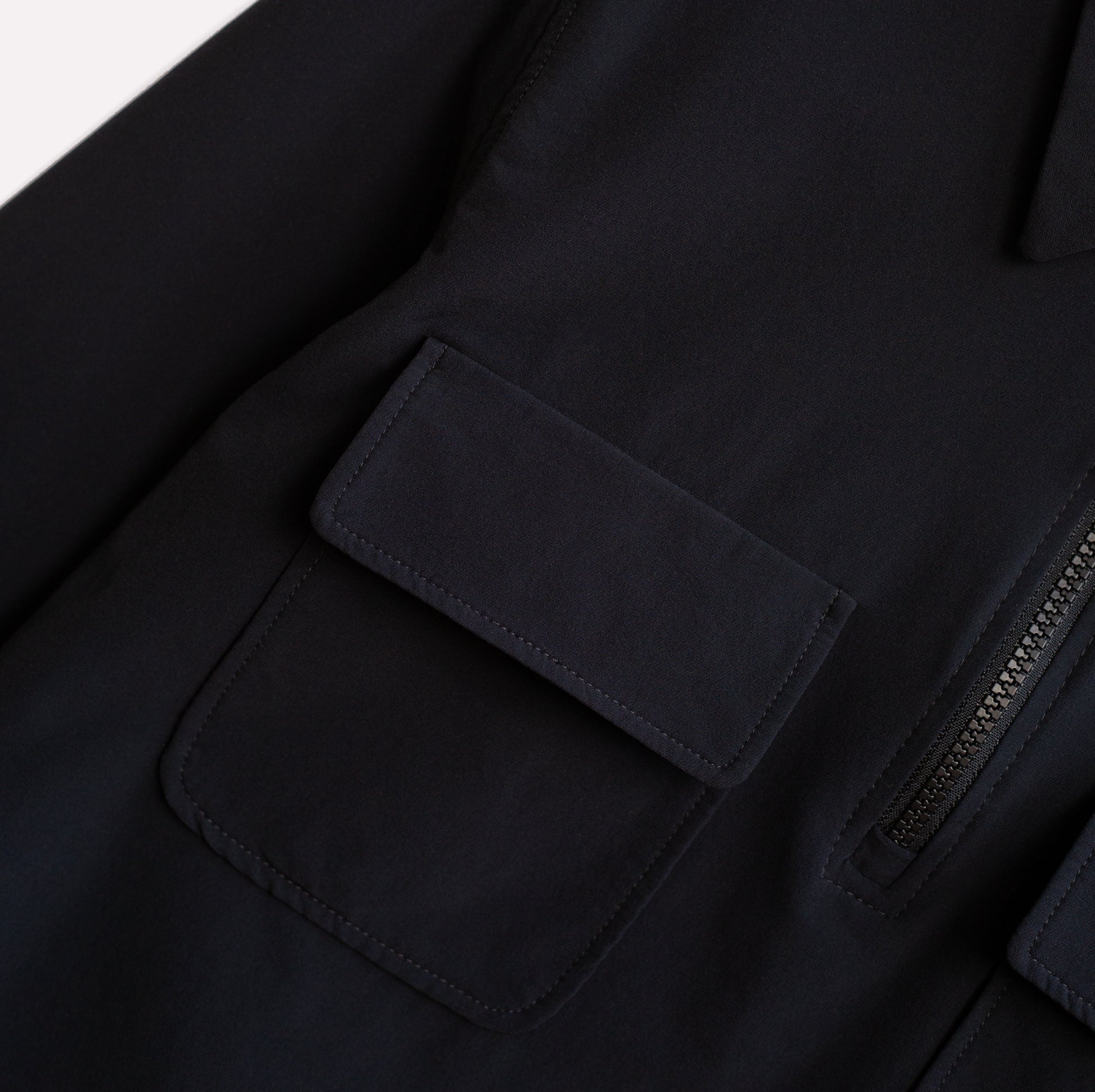 Shirt pockets on lightweight climbing half-zip shirt.